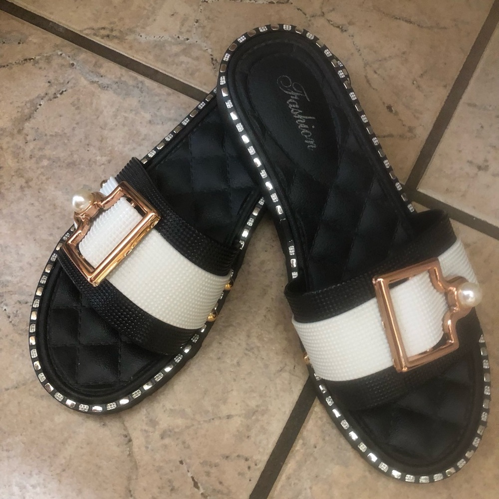 Black and White Slide Sandals with gold tone buckle and pearl